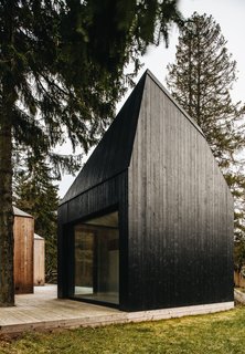This Forest Retreat Is a Modern Take on the Traditional Estonian Hut - Photo 8 of 12 - The sauna cabin bears a coat of black tar.