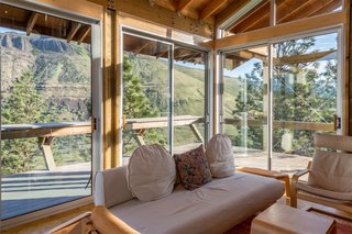 The home also features a deck that wraps around the living area.