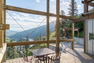 The interiors—which are integrated into the terrain—present dramatic vistas of the river below, as well as the surrounding mountains. 
