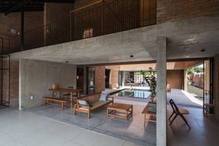 Light and Shadow Help Shape This Modern Brick House in Vietnam - Photo 4 of 15 - The open-plan living and dining room.