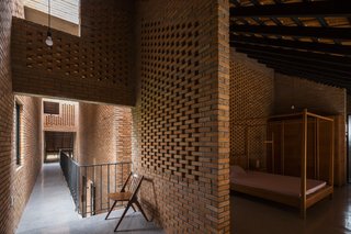 Light and Shadow Help Shape This Modern Brick House in Vietnam - Photo 10 of 15 - A bedroom on the upper level.