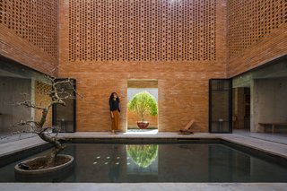 Light and Shadow Help Shape This Modern Brick House in Vietnam - Photo 7 of 15 - The courtyard at the center of the house opens up to the environment.