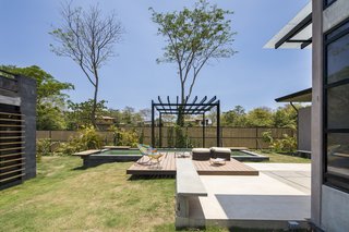 A Concrete Abode Becomes a Surfer's Paradise - Photo 2 of 23 - The house features a pool and sun deck on the eastern side of the plot.