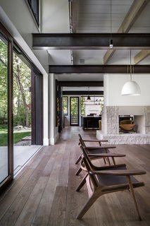 Nestled among trees and apple orchards, this warm and inviting family home makes the most of its peaceful wooded plot.