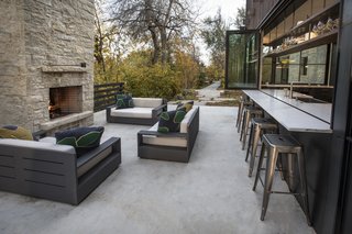 The kitchen bar counter extends out to the patio, creating a great space for entertaining.