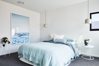 This light blue bedroom was inspired by the home's coastal location.