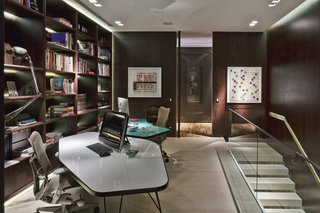 On the upper level is the master and guest bedrooms, an office, and fitness room.