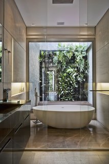 There is also a bathroom with a freestanding tub on the upper level.