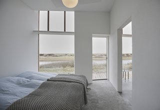 The lake-facing outdoor terrace can be accessed through the bedroom.