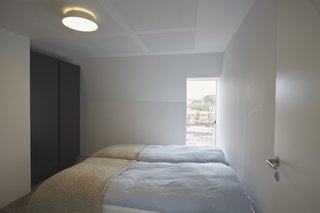 The bedrooms are fitted with simple furniture, creating cool vibes and a calming atmosphere.