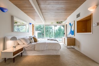 A bedroom looks out to canyon views.