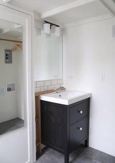 The bathroom is located at the back of the house.
