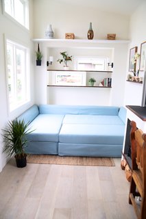 The light blue sofa bed has been purchased from IKEA.