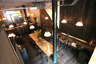 The old elevator shaft was transformed into a suspended DJ booth, where guests can enjoy live "supper house" music as they knock back a pint or two, and nibble on small sharing plates.