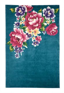 Protect floors from scuffing, and introduce graphic artwork to your room, with a statement-making area rug.