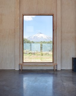Polished concrete mixed with black volcanic sand is used for the floor, while the ceilings are lined in plasterboard. 