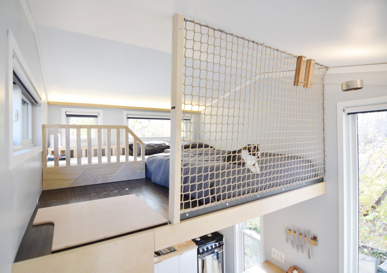 when it came time to add a safety barrier for their daughter Aubrin, they opted to install tight netting so the two areas did not need to be visually separated.