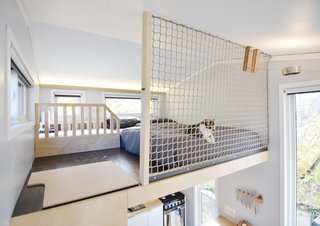 When it came time to add a safety barrier for their daughter Aubrin, they opted to install tight netting so the two areas did not need to be visually separated.