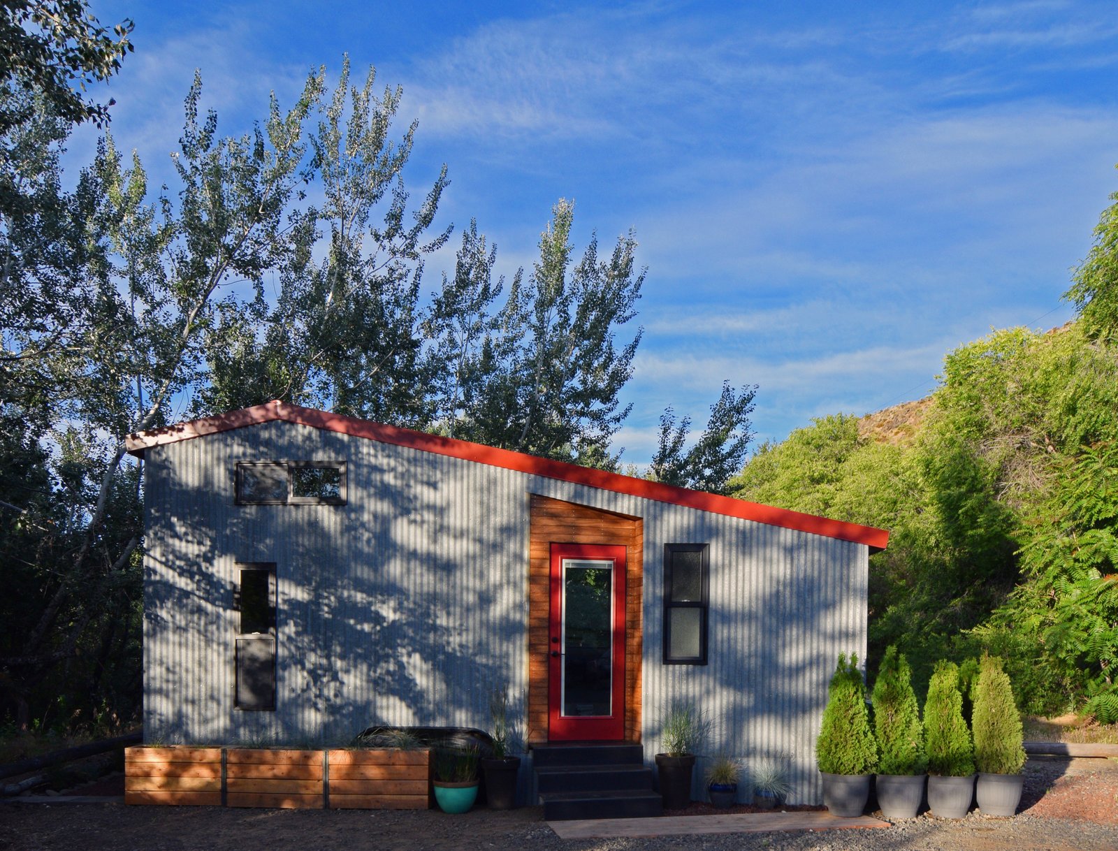 Corrugated metal siding on the front of the house.