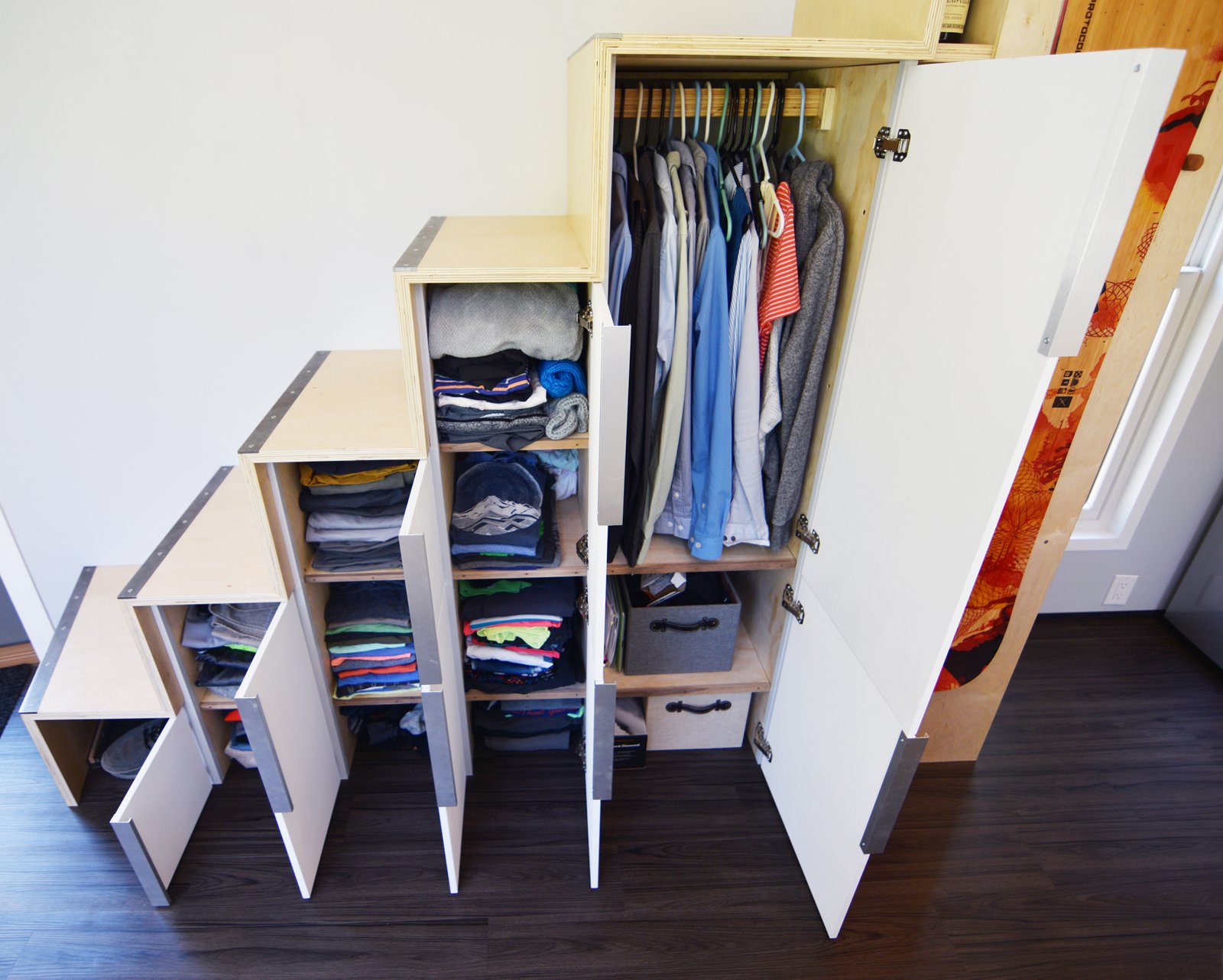 Plenty of storage spaces were created under the stairs.