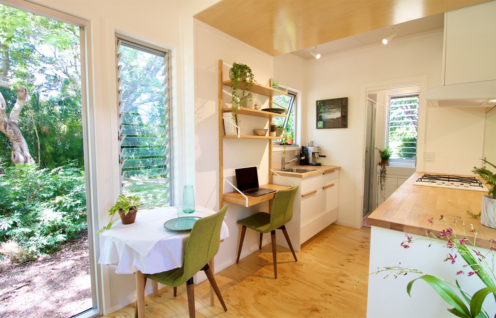 Every interior section offers expansive outdoor views through generous windows.