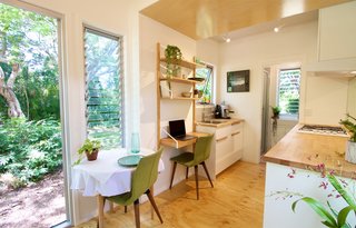 This Midcentury-Inspired Tiny House Radiates Clever Design - Photo 6 of 10 - Every interior section offers expansive outdoor views through generous windows. 