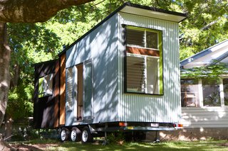 This Midcentury-Inspired Tiny House Radiates Clever Design - Photo 3 of 10 - The house can accommodate a range of optional extras such as shelving, storage, window/door additions, awnings, planter boxes, and more. 