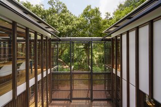 The pavilions are connected by multiple stairwells, open decks, and covered walkways that wind along the outdoor areas.