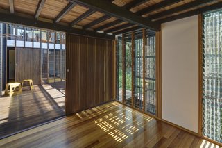 The indoor/outdoor feel of the house is intensified by the three primary views of the river, towards the forested entry path, and to the sky.
