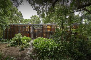The house includes four bedrooms, two bathrooms, and an artists’ studio.