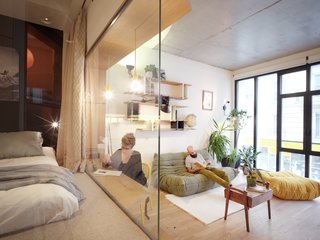 "With a single contribution of natural light from the windowed facade facing street, the apartment is designed to be 'turned' toward this light with its glass rooms. Elements holding the old garage function were kept as witnesses and graphic structures of the apartment," explains Pelcé.