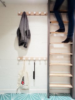 Toys and coats are stored in the playroom to keep the rest of the home neat and tidy. 
