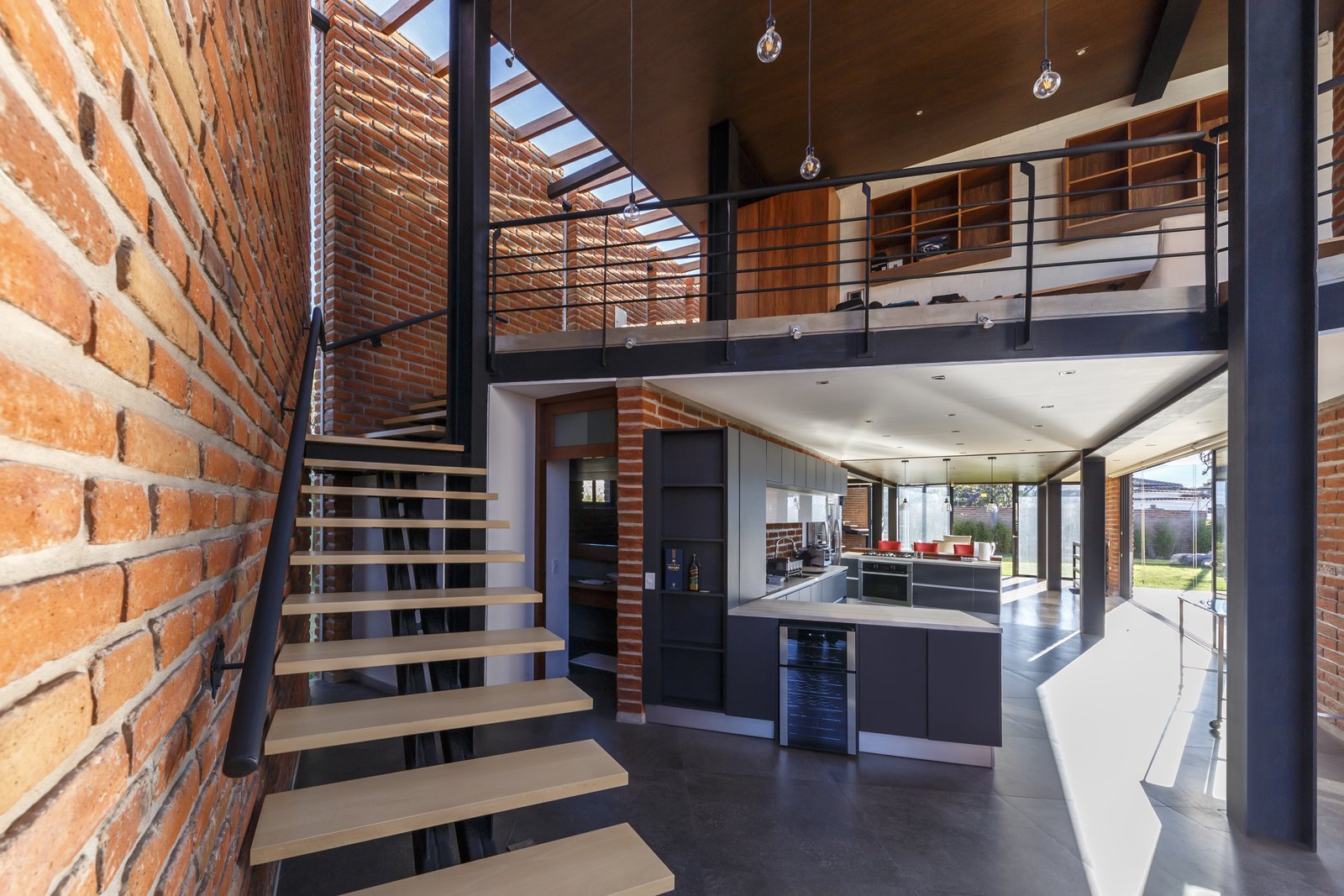 The kitchen and a bathroom on the ground level.