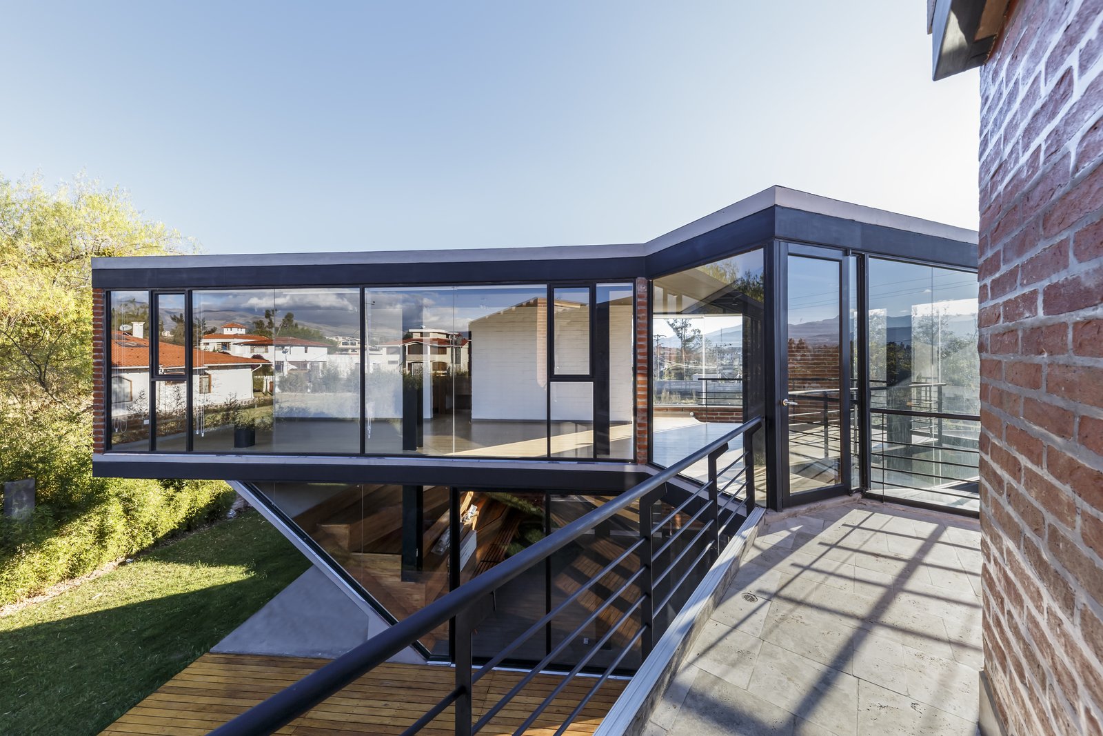 The second C folds towards the interior, and takes in the morning sun.