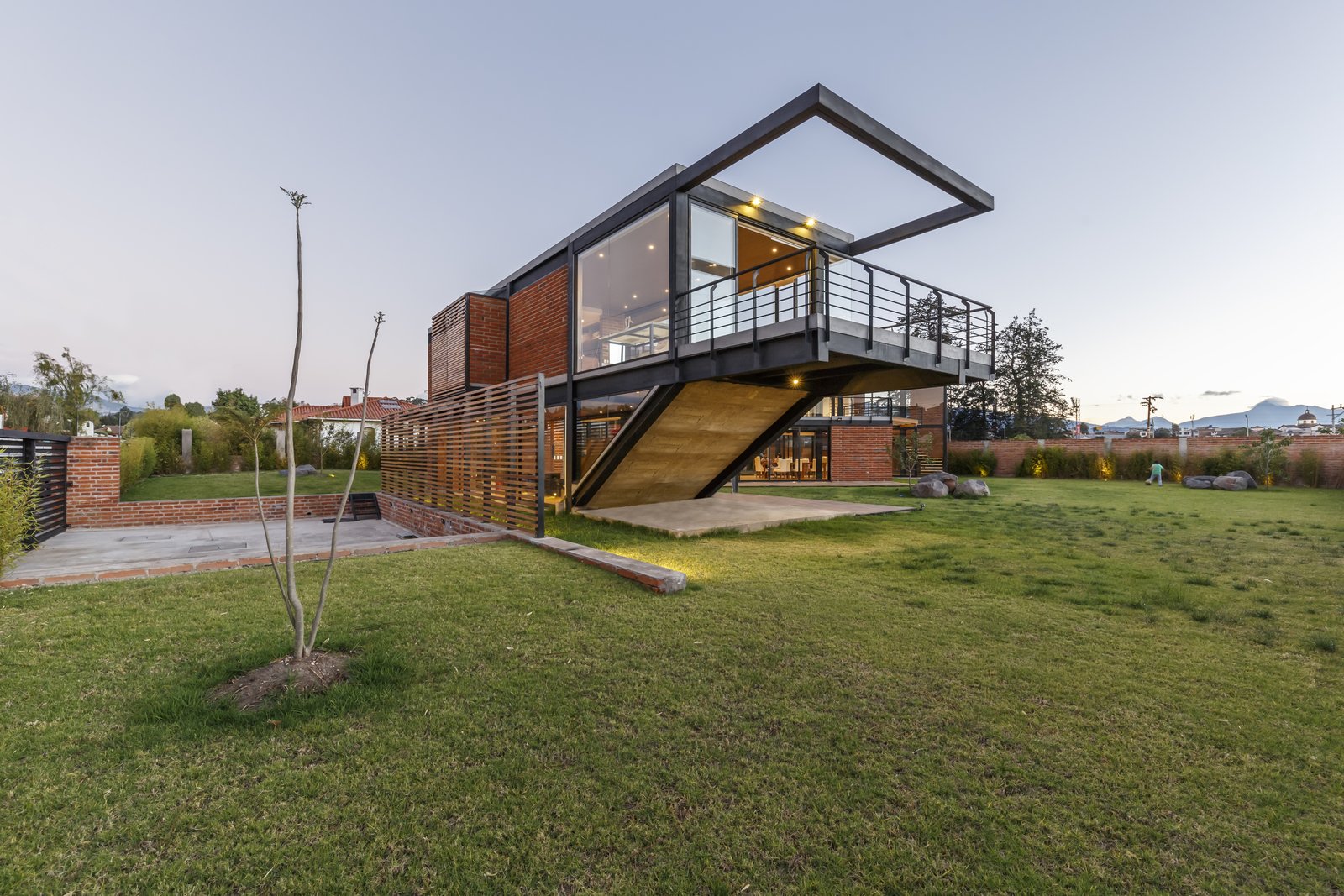 To enable the two families to live independently, and interdependently, Estudio A0 co-founder Ana María Durán Calisto came up with a 5,457-square-foot home that consists of two volumes, set in a Z formation.