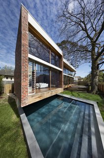 An Airy New Pavilion Lets One Family Practically Live in a Park - Photo 1 of 9 - Insulated glass was used for the floor-to-ceiling windows.