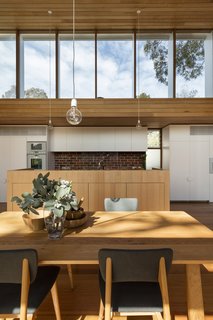 An Airy New Pavilion Lets One Family Practically Live in a Park - Photo 9 of 9 - Venetian blinds were installed on the exterior of the windows to mitigate heat. 