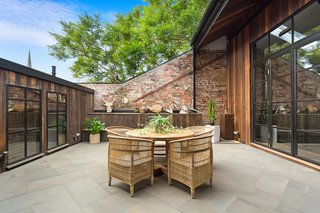 Polished concrete and exposed bricks give the home an industrial look.