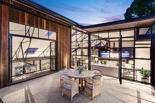 The open-plan upper level includes a private rooftop terrace.