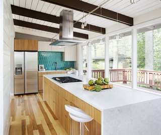 Ceaserstone in Blizzard was used for the perimeter countertop; and Silestone in Lusso for the island top and the waterfall edges. 