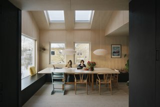 Family members can lead their own pursuits at the communal table, occupying an in-between space.