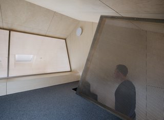 "The darkness in the loft evokes a feeling of the world being expansive," says Austigard.