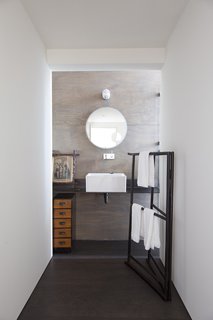 The result is a visually clean house composed of a pure vernacular shape, with all functional elements distilled to their basic requirements.
