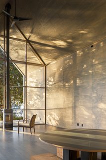 Natural light is able to flood inside thanks to the floor-to-ceiling windows.