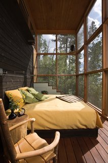 A screened sleeping porch connects each of the bedrooms to the outdoors. 