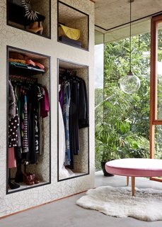 Hand-printed wallpaper by Erica Wakerly livens up the dressing room.
