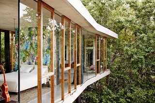 Architect-builder Jesse Bennett and interior designer Anne-Marie Campagnolo camped on site during the build of Planchonella House, whose exuberant design mirrors its tropical environment. 