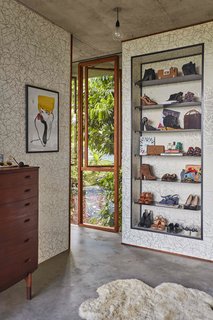 Most of the furniture and fixtures, including the tables, bathtub, wardrobe, clothes hooks, and door handles, were handcrafted by Bennett. 
