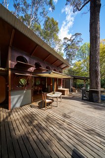 Long decking boards extend out into Pittwater, the valley estuary that holds Osborne House.