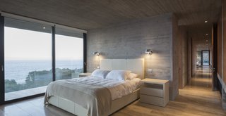 The master bedroom with an ensuite bathroom is also located on the access level.